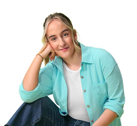 Karabeth, a young woman living with XLH, sitting relaxed with her hand resting against her cheek, smiling